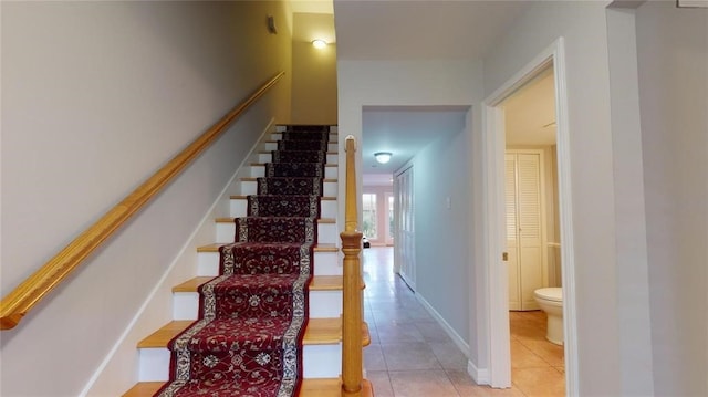 staircase with tile patterned flooring