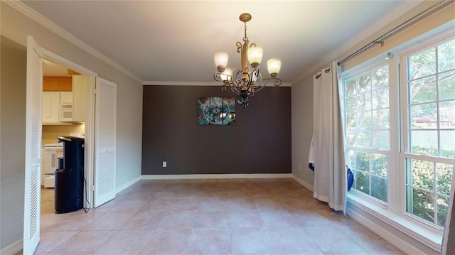 unfurnished dining area with crown molding, an inviting chandelier, and a wealth of natural light