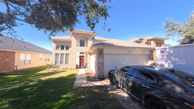 view of front of house featuring a garage and a front yard