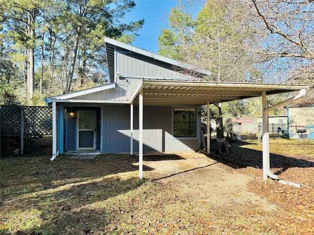 exterior space featuring a carport