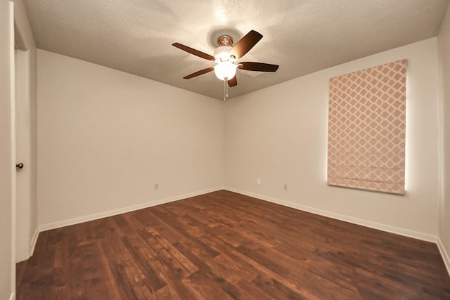 spare room featuring ceiling fan, a textured ceiling, and dark hardwood / wood-style flooring