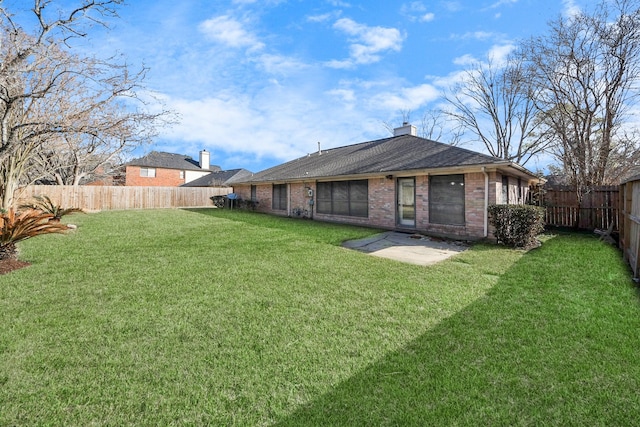 back of house featuring a yard