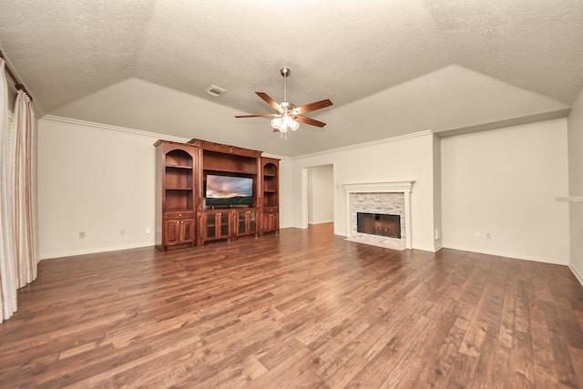 unfurnished living room featuring ceiling fan, lofted ceiling, dark hardwood / wood-style floors, and a textured ceiling