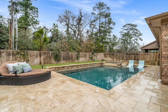 view of pool with a patio and an in ground hot tub