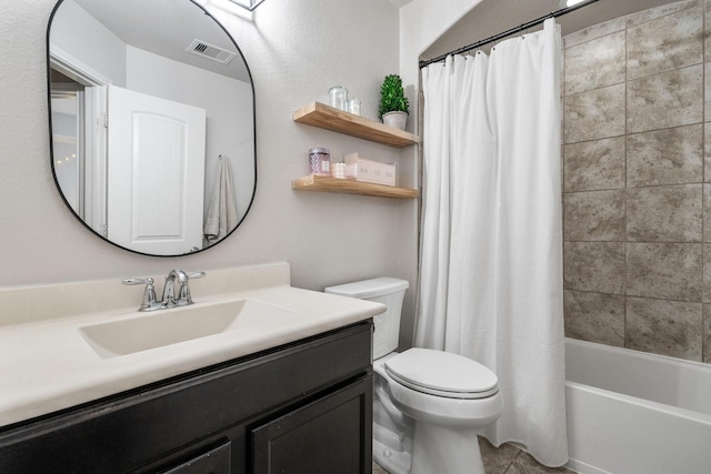 full bathroom featuring vanity, shower / bath combination with curtain, and toilet