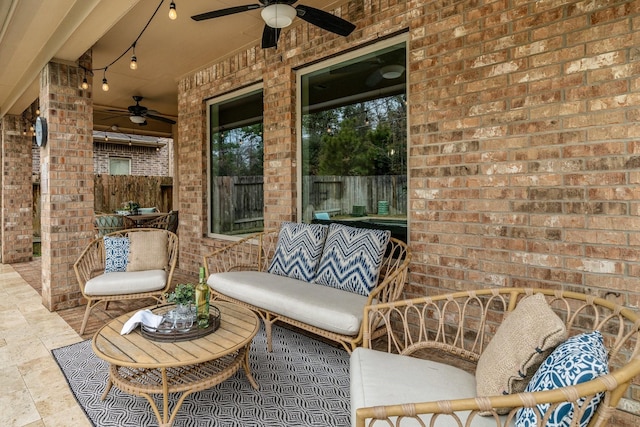 view of patio featuring ceiling fan