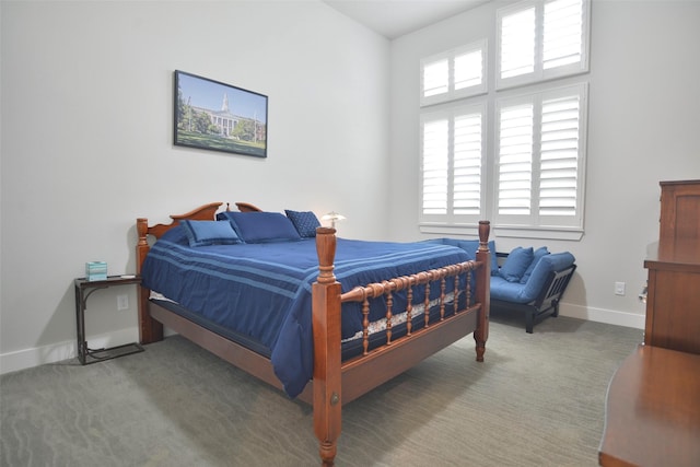 carpeted bedroom with baseboards