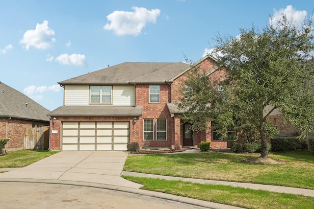 view of front of property with concrete driveway, an attached garage, fence, a front lawn, and brick siding