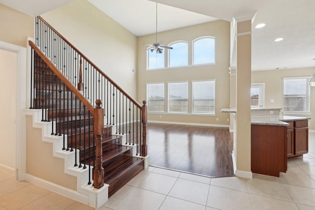 interior space featuring light tile patterned floors, ceiling fan, plenty of natural light, and recessed lighting