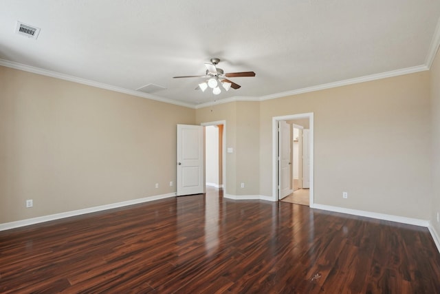 empty room with dark wood-style flooring, a ceiling fan, visible vents, baseboards, and crown molding