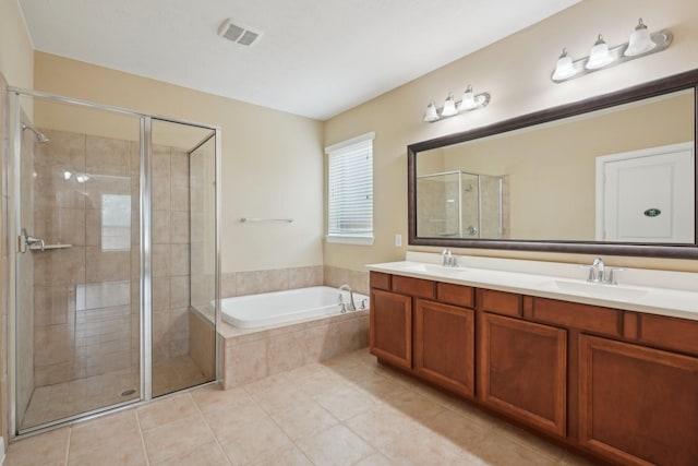 bathroom featuring visible vents, a stall shower, a sink, and a bath