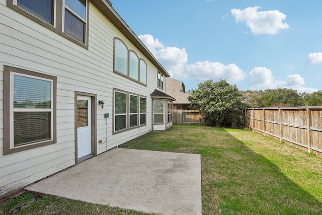 view of yard with a patio area and a fenced backyard