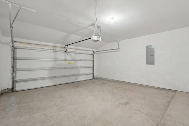 garage featuring electric panel and a garage door opener