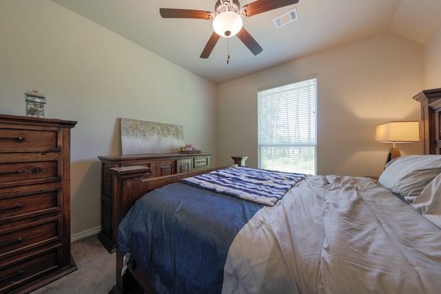 carpeted bedroom featuring ceiling fan and vaulted ceiling