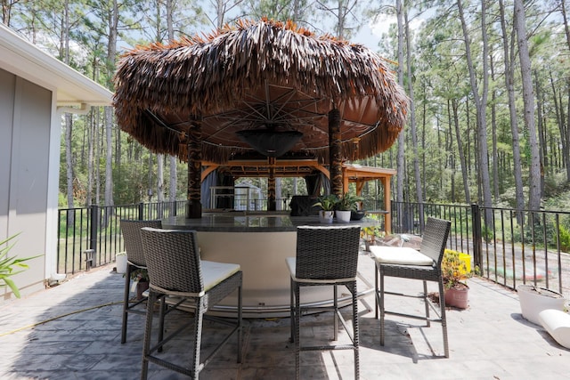view of patio featuring an outdoor bar