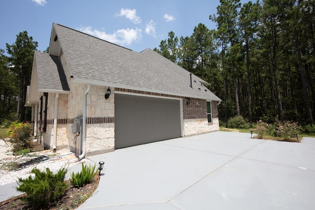 view of side of home with a garage