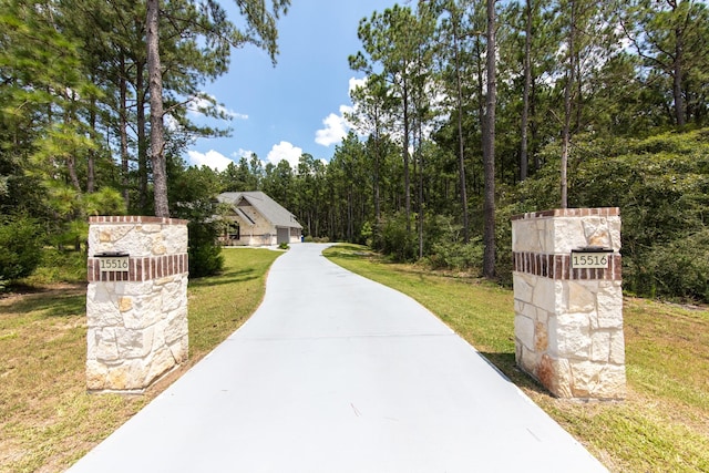 view of home's community with a yard