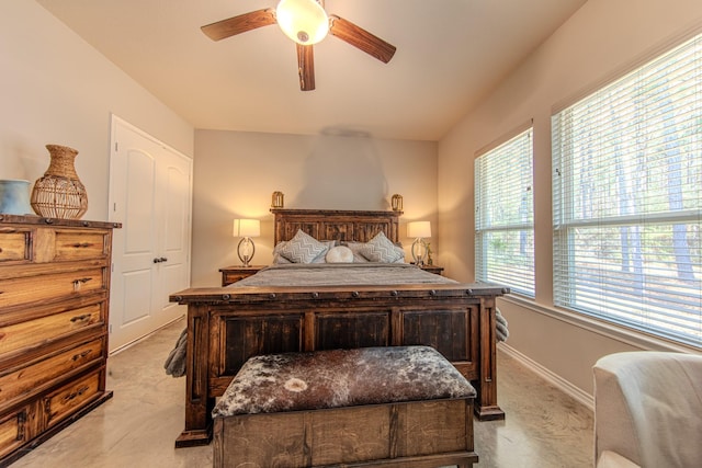 bedroom featuring light carpet and ceiling fan