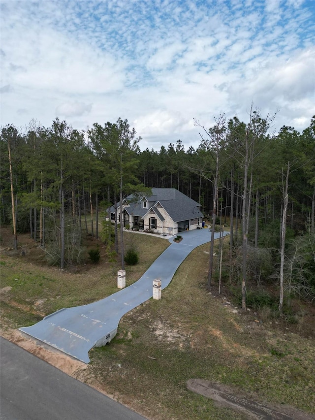 15516 Forest Grove Dr, Willis, TX 77378 - view of property's community with a forest view and driveway