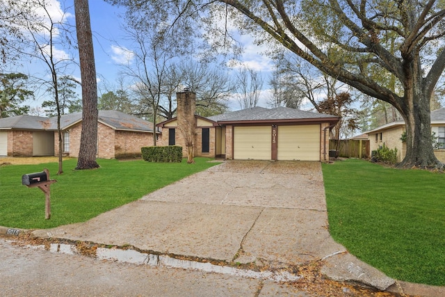 ranch-style home with a garage and a front lawn