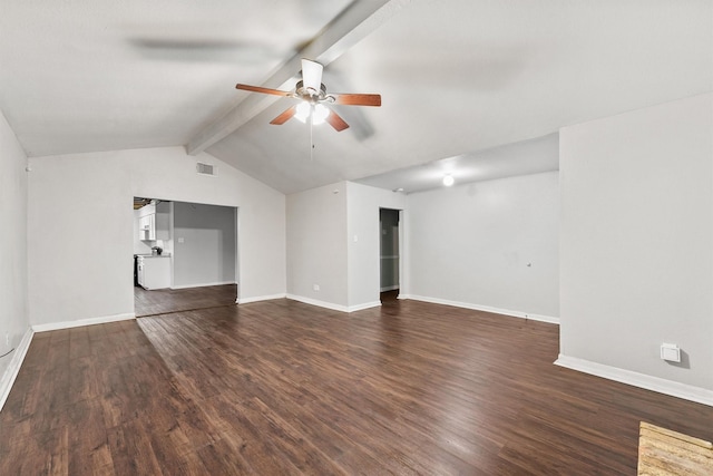 empty room featuring dark hardwood / wood-style flooring, lofted ceiling with beams, and ceiling fan