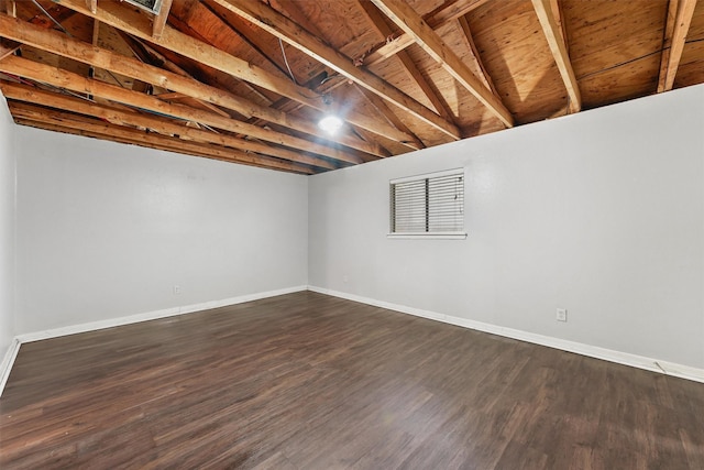 basement with dark wood-type flooring