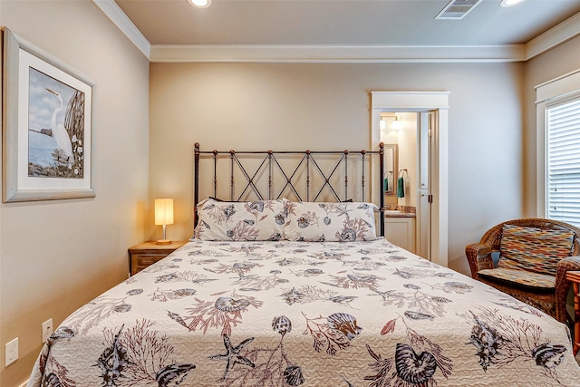 bedroom featuring ornamental molding and connected bathroom