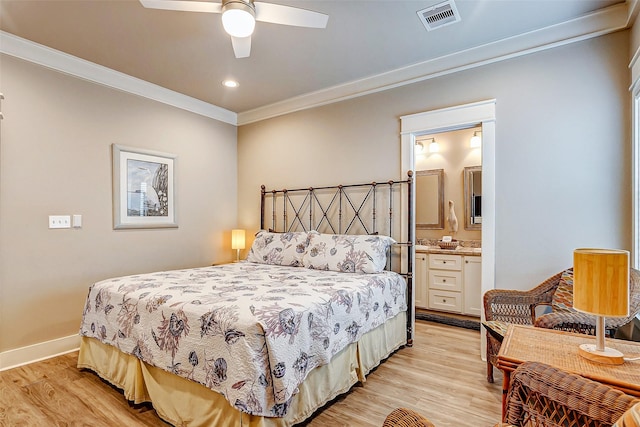 bedroom featuring ceiling fan, ensuite bath, ornamental molding, and light hardwood / wood-style flooring