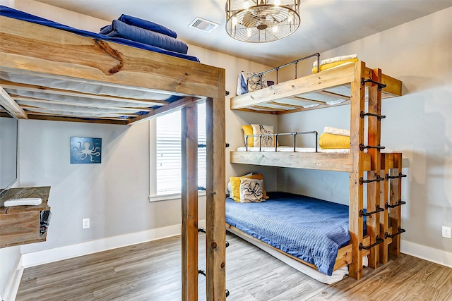 bedroom with wood-type flooring