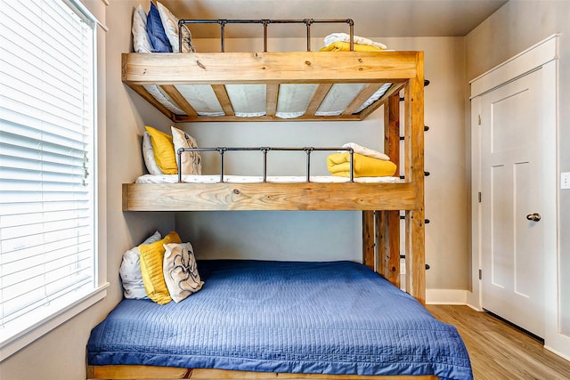 bedroom with hardwood / wood-style floors