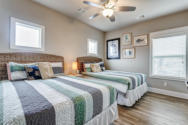 bedroom with hardwood / wood-style flooring and ceiling fan