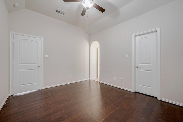 unfurnished room featuring dark hardwood / wood-style flooring, vaulted ceiling, and ceiling fan