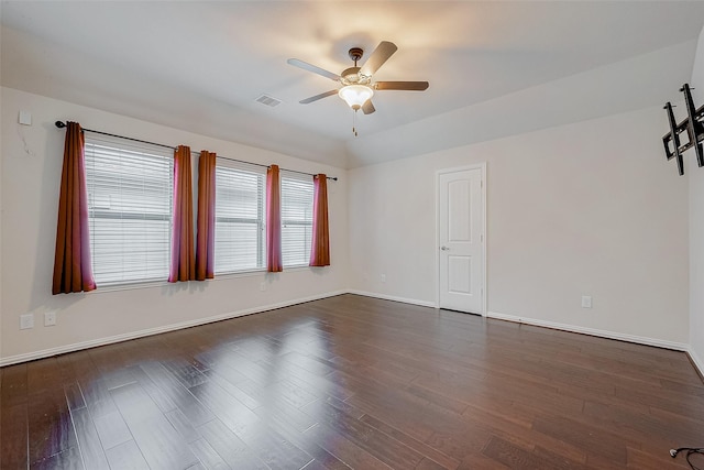 unfurnished room featuring ceiling fan and dark hardwood / wood-style floors