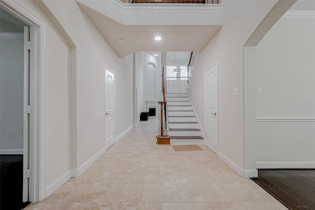 stairway with tile patterned flooring