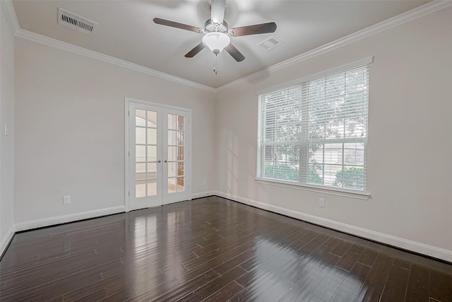 empty room featuring ornamental molding, dark wood-type flooring, ceiling fan, and french doors