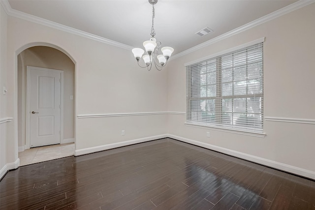 unfurnished room featuring crown molding, a notable chandelier, and hardwood / wood-style flooring