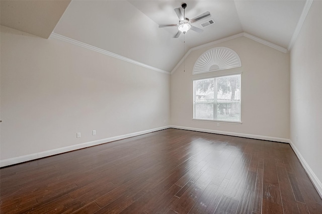 empty room featuring lofted ceiling, dark wood-type flooring, and ceiling fan