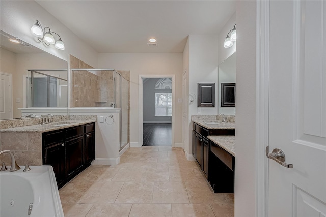 bathroom featuring vanity, an enclosed shower, and tile patterned flooring