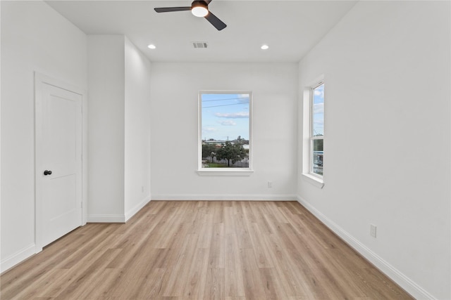 spare room with ceiling fan and light hardwood / wood-style floors