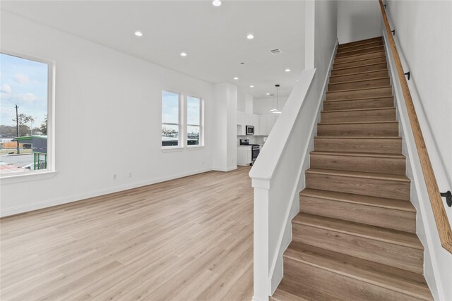 6350 Culberson St, Houston, TX 77021 - stairway featuring wood-type flooring