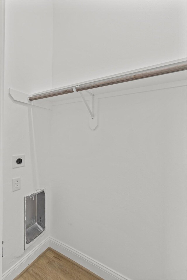 6350 Culberson St, Houston, TX 77021 - clothes washing area featuring electric dryer hookup and hardwood / wood-style floors