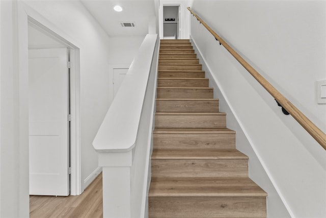 stairway with wood-type flooring