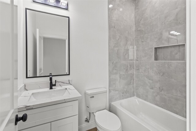 6350 Culberson St, Houston, TX 77021 - full bathroom featuring tiled shower / bath combo, vanity, and toilet