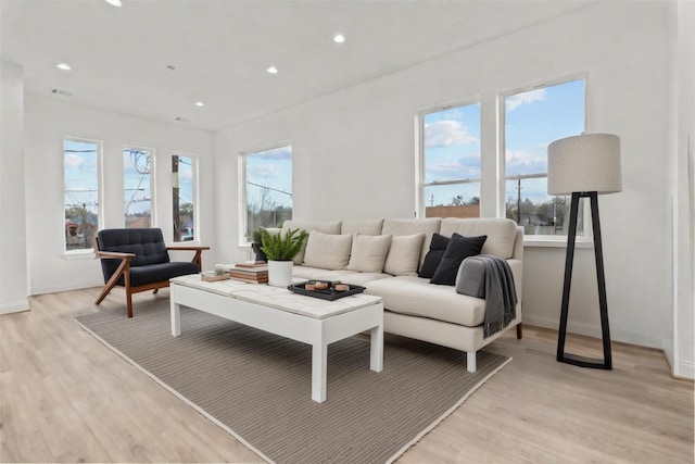 living room with light hardwood / wood-style floors