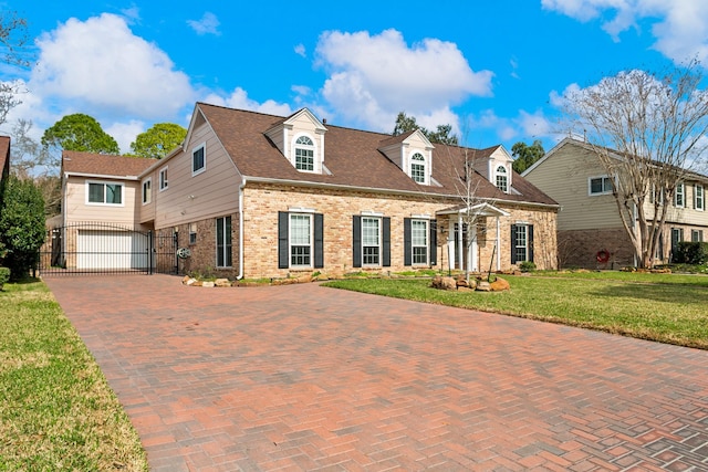 view of front facade with a garage and a front lawn