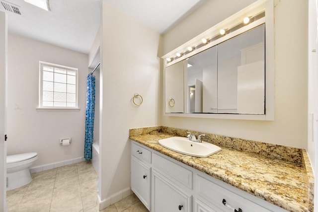 full bathroom featuring vanity, shower / bath combo, tile patterned floors, and toilet