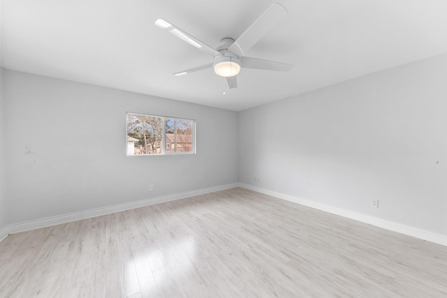 empty room featuring ceiling fan and light wood-type flooring