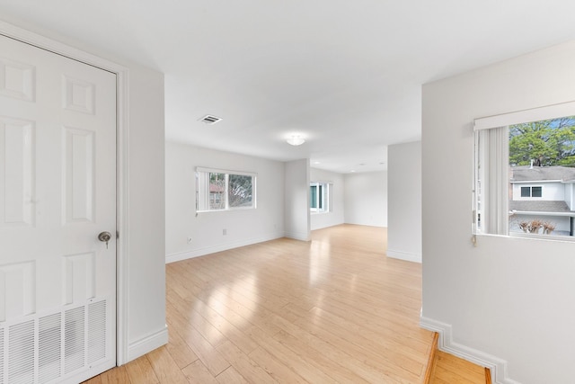 unfurnished room with light hardwood / wood-style floors