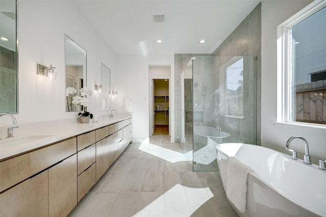 bathroom featuring vanity, tile patterned floors, and independent shower and bath