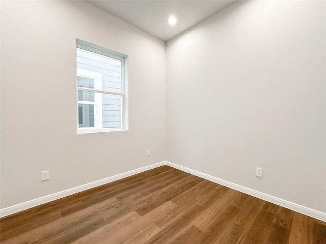 spare room with hardwood / wood-style floors